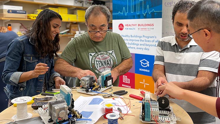 A group of researchers assembling measurement equipment